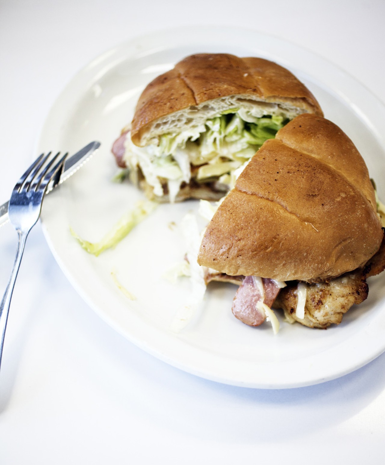 The Torta Tejana is a chicken, sausage, cheese, lettuce, tomato, beans, avocado and jalapeno sandwich.