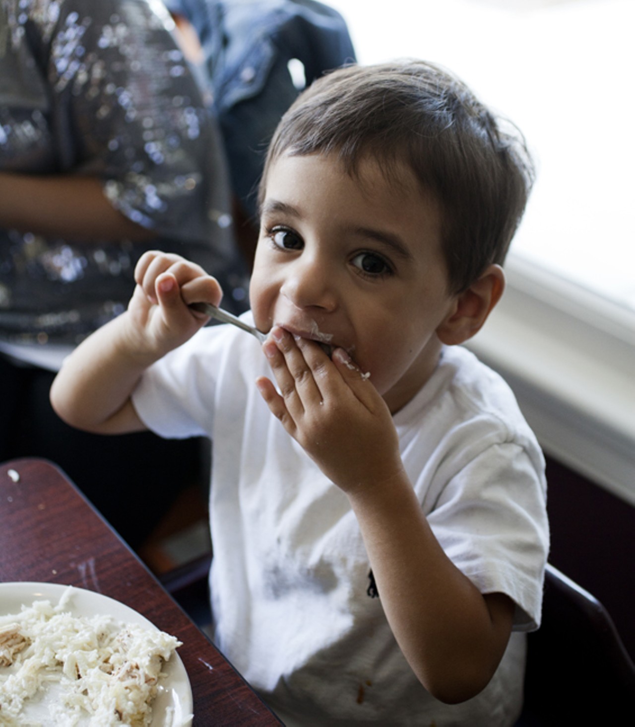 Two year old customer Aymen Jaouni enjoying his lunch at Layla.