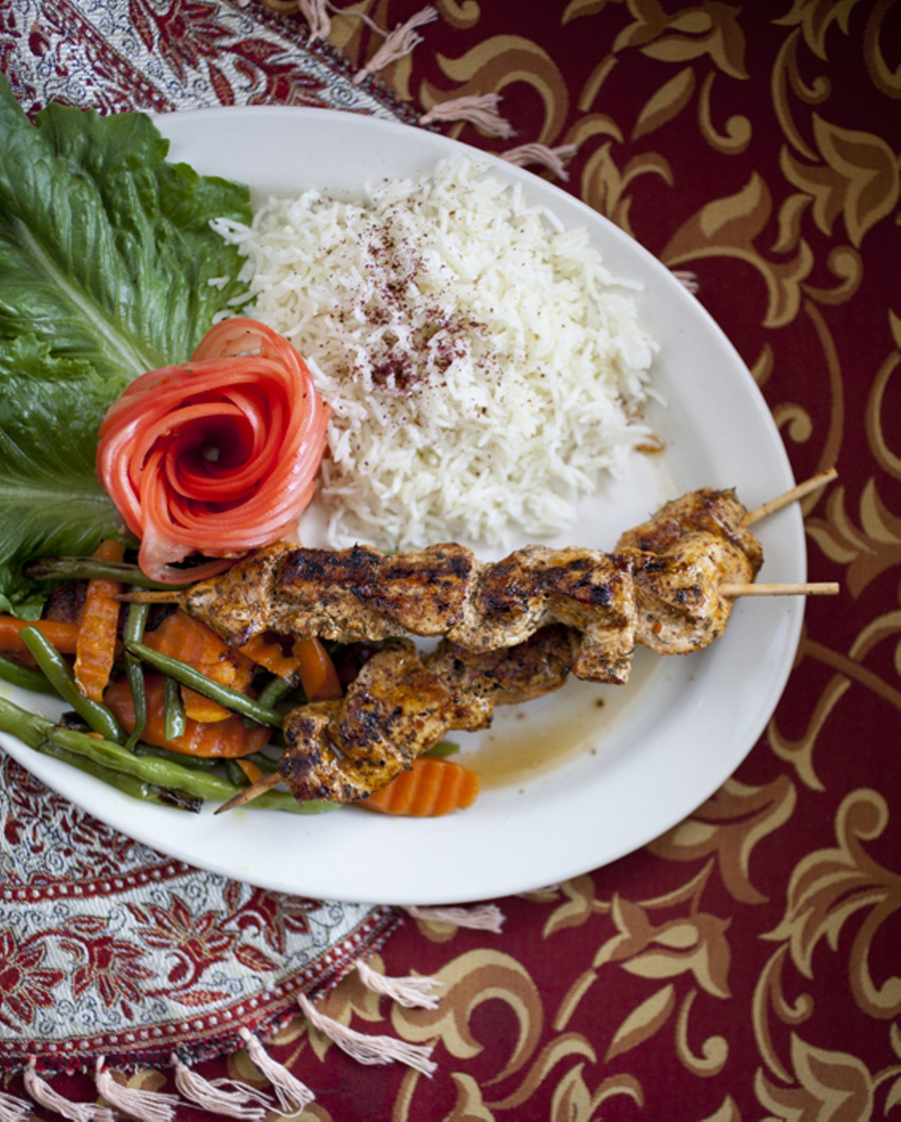 Chicken Shish Kabab - grilled chicken breast marinated in garlic, lemon juice and a spice blend served on a skewer with basmati rice and seasonal fresh vegetables.