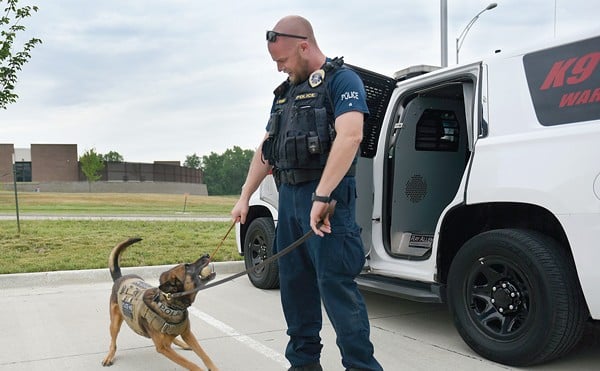 Columbia Police officer Eric Wiegman rewards K-9 Nero for obeying a string of commands June 8 at the Molly Thomas Bowden Neighborhood Policing Center in Columbia. Nero needs a play session throughout his patrol shift.