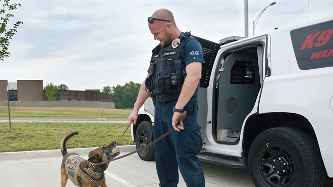 Columbia Police officer Eric Wiegman rewards K-9 Nero for obeying a string of commands June 8 at the Molly Thomas Bowden Neighborhood Policing Center in Columbia. Nero needs a play session throughout his patrol shift.