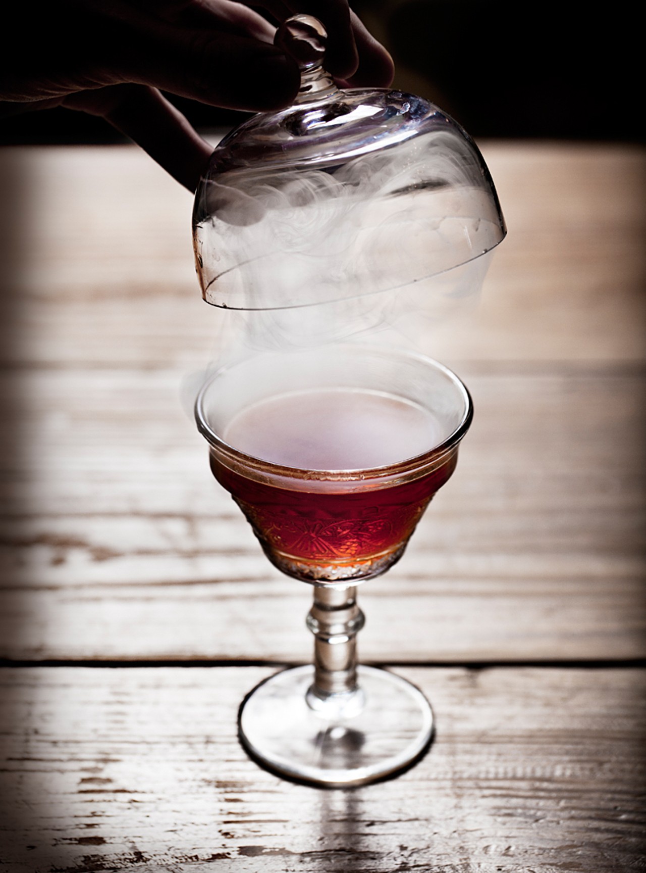 The No. 5 1/2 is a smoke canopy, koval white millet whiskey, housemade sweet vermouth, lillet blanc, port and barkeep apple bitters.