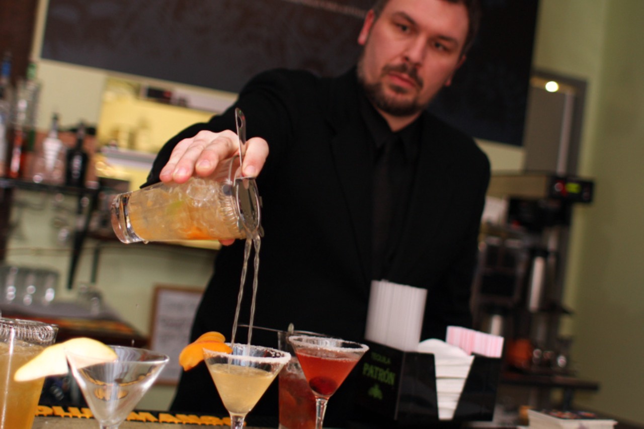 Chris Hansen pours a cocktail.