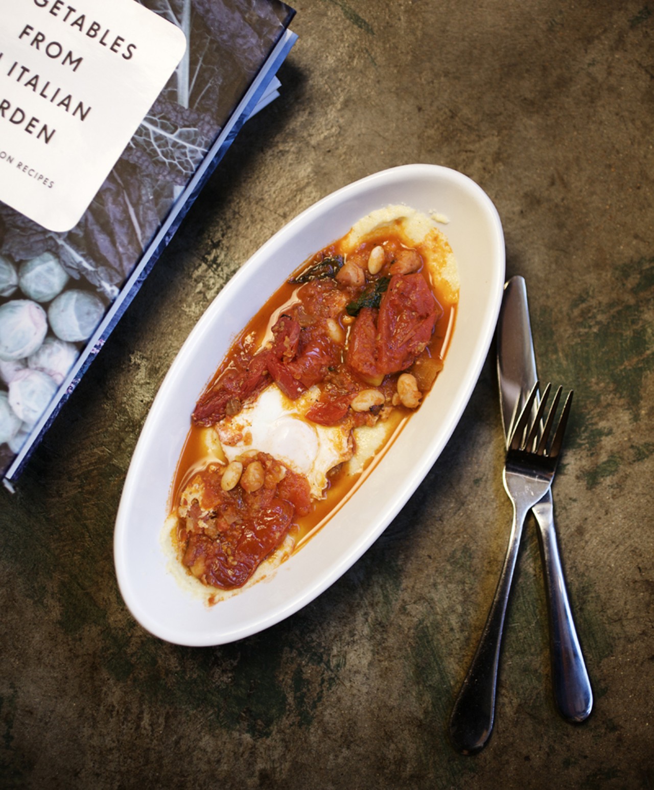 From the Antipasti menu, Hunter's Egg. It is served with beans, pancetta and polenta.
