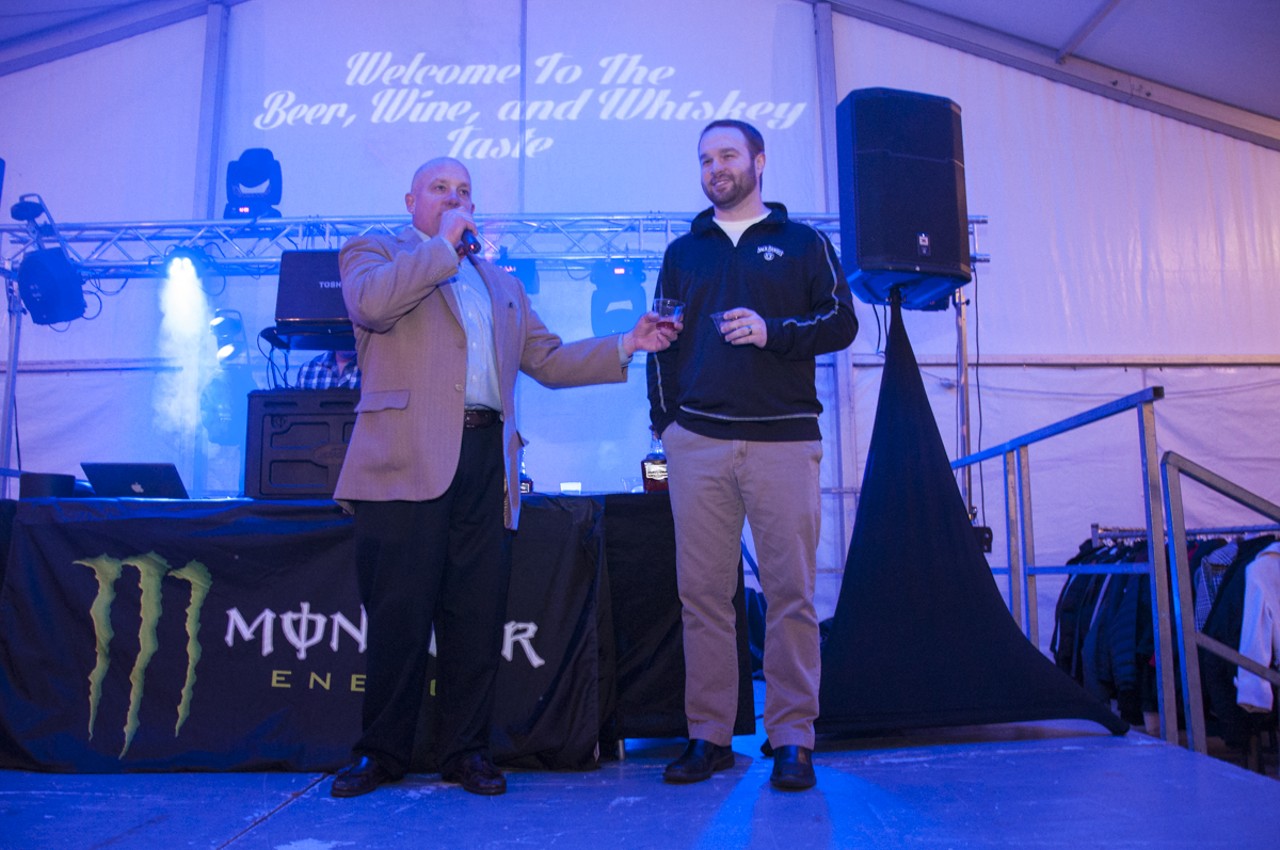 Tim Lorson presenting Chris Fletcher master distiller from Jack Daniels and announcing that there was a single Jack Daniels barrel that was selected and bottled for this St. louis Mardi Gras kickoff event.