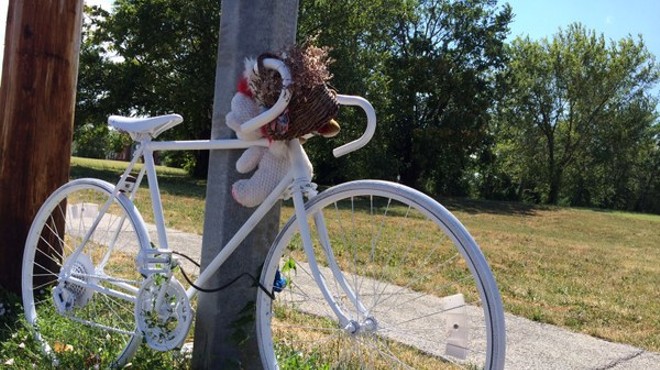 A bike memorial marks the spot where a cyclist died on the roadway. To prevent more of these, the city plans to invest $40 million in traffic calming measures.