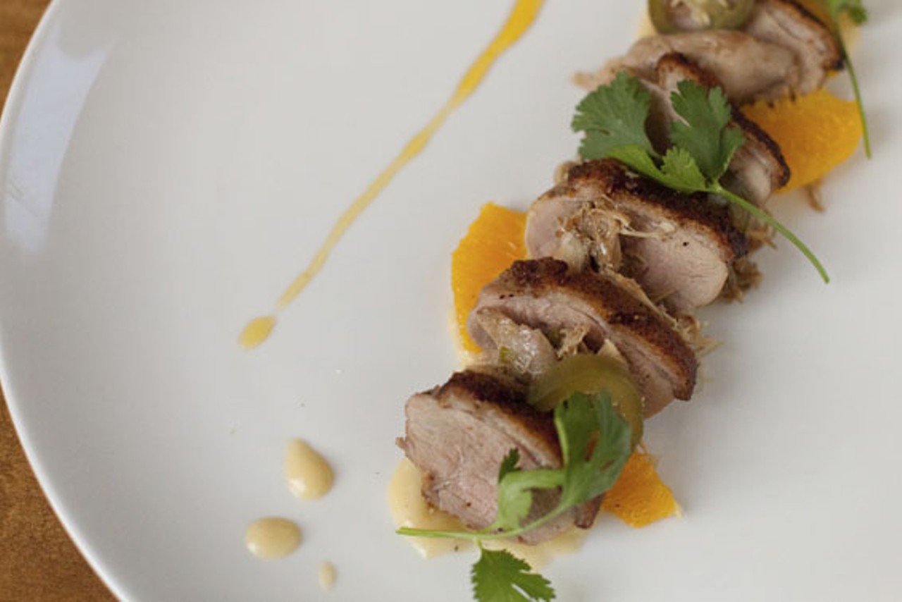 Pato Agridulce - Seared duck breast, sweet and spicy confit, corn tortilla puree and oranges.