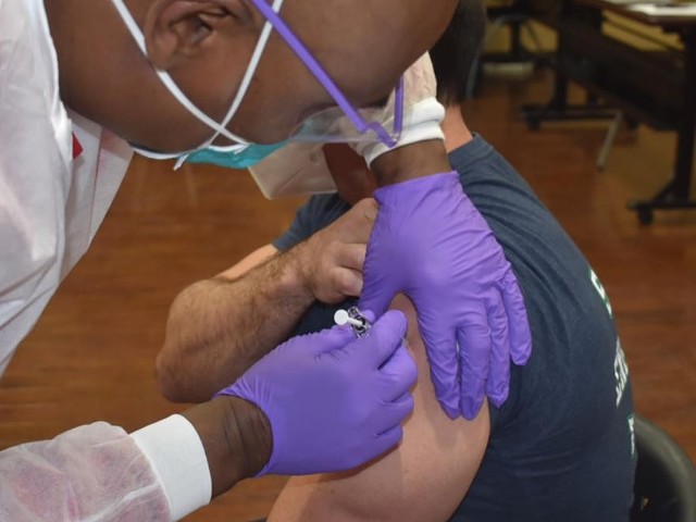 St. Louis distributed the first dose of vaccines to first responders last week. But Missouri is lagging.