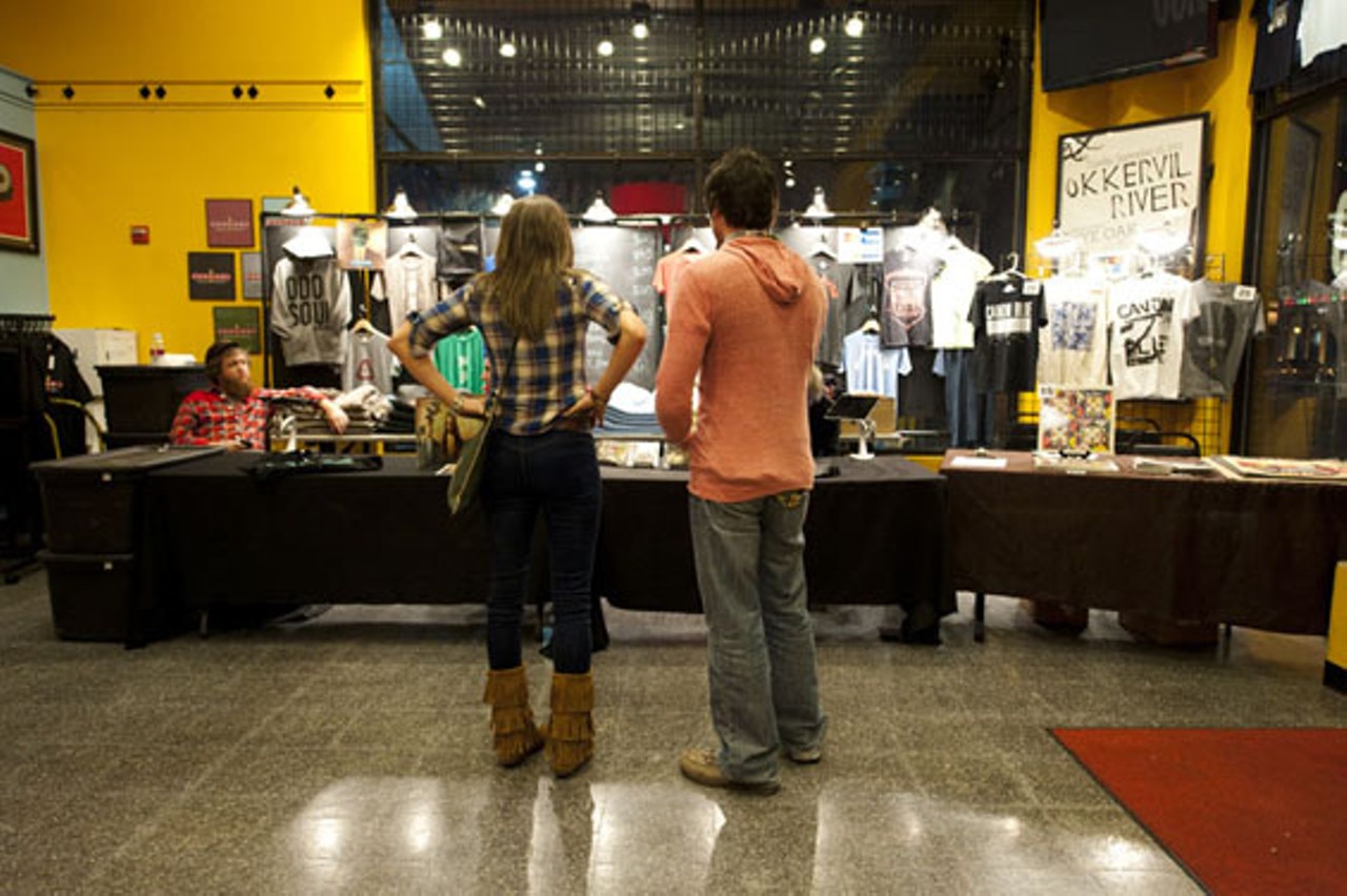 MuteMath fans examine the merchandise table before the show.