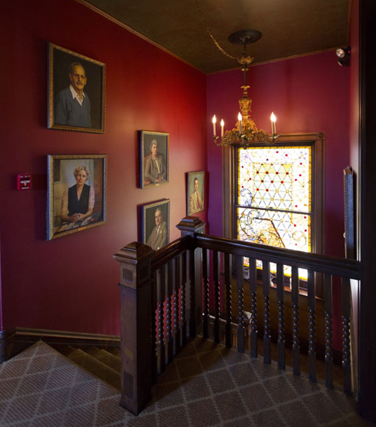 In the stairwell to the second floor are paintings of the owner and her family.