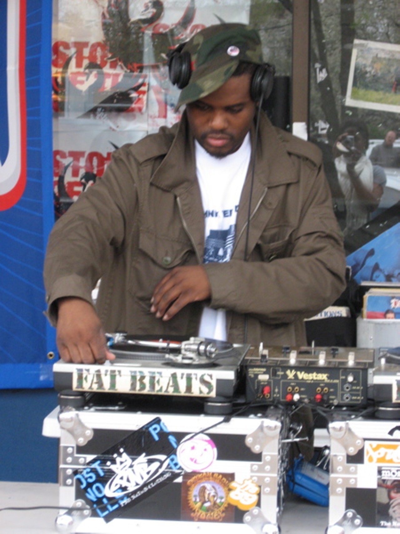 DJ Needles spins outside the store.