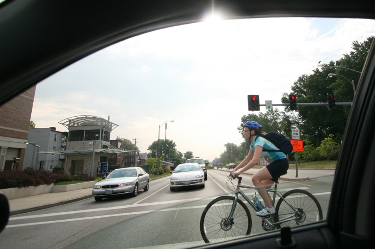 A rider bikes through Skinker Boulevard and Forest Park Parkway, on her way to Big Shark, a bicycle store that served as one of the check-points.