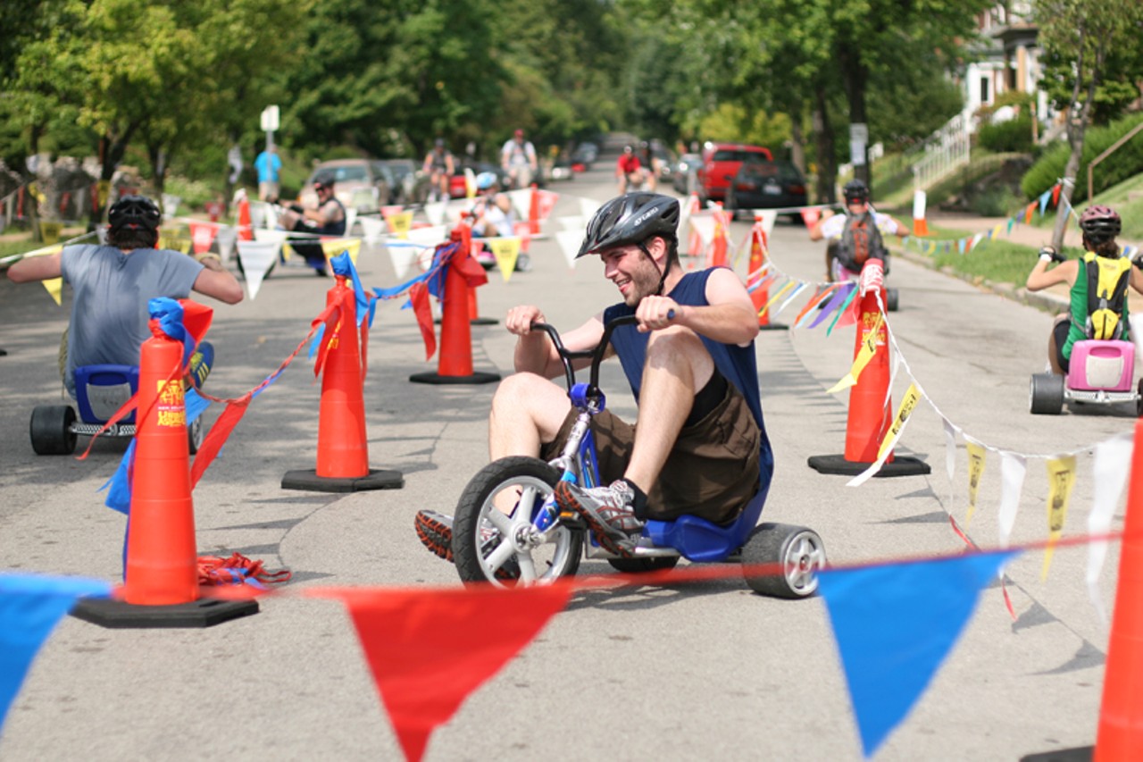 Riders put the pedal to the metal on big wheels at the Spin Out obstacle outside of BicycleWORKS. Riders must simply navigate the coned course.