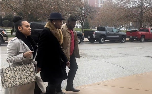 John Collins-Muhammad walking into the courthouse on Tuesday to be sentenced in a federal corruption scheme.