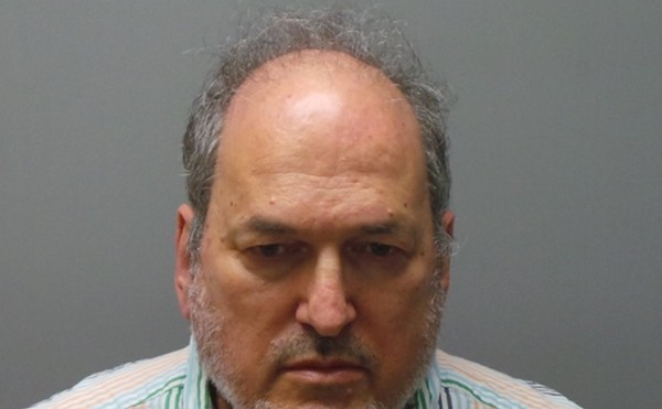 Dr. Craig Spiegel, shown in his mugshot. He remains in custody without bond.