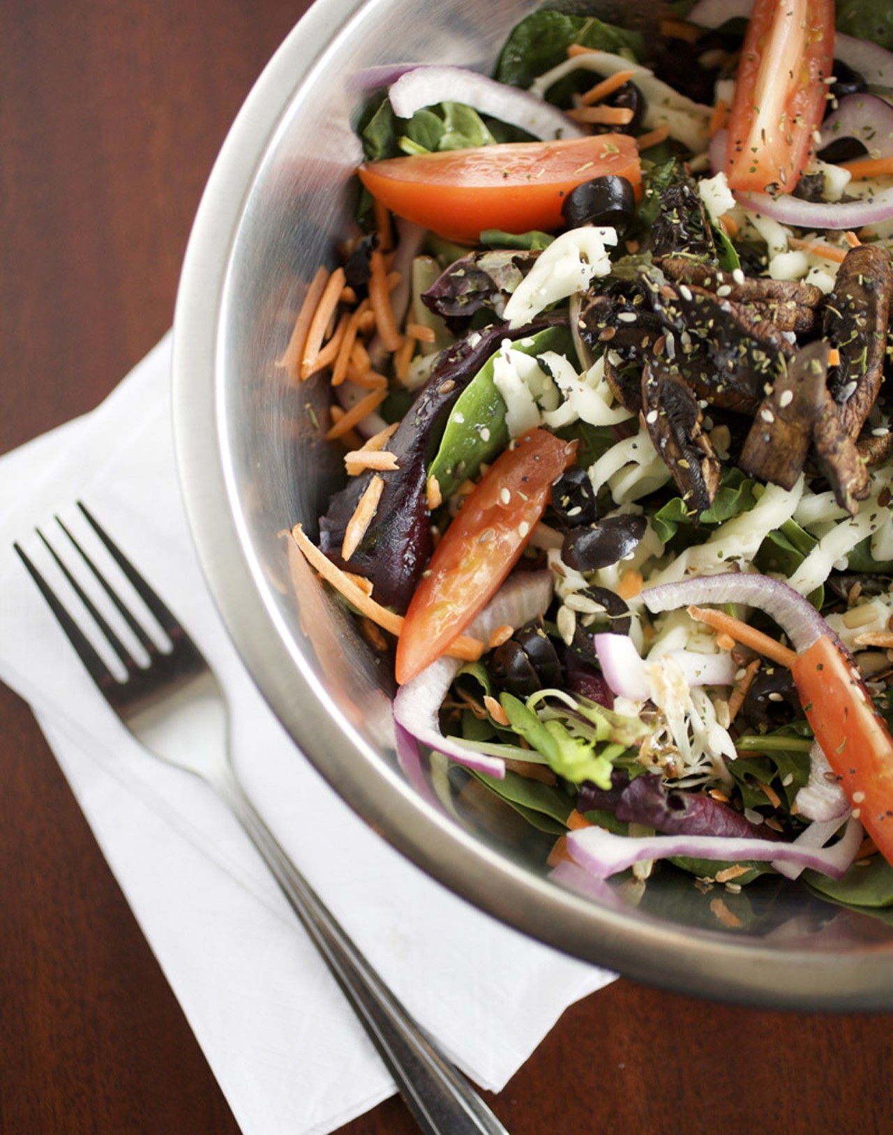 The Hemp Garden Salad is made with a Sring mix, tomatoes, carrots, red onions, black olives, smoked portabella mushrooms and the dressing is the locally owned, Greg's Hemp Oil vinaigrette.