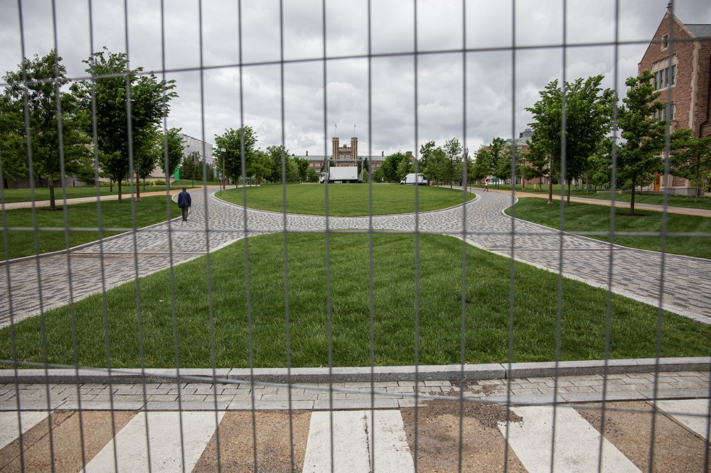 A metal fence blacks off the entrance to Wash U’s Danforth Campus along Skinker Boulevard.