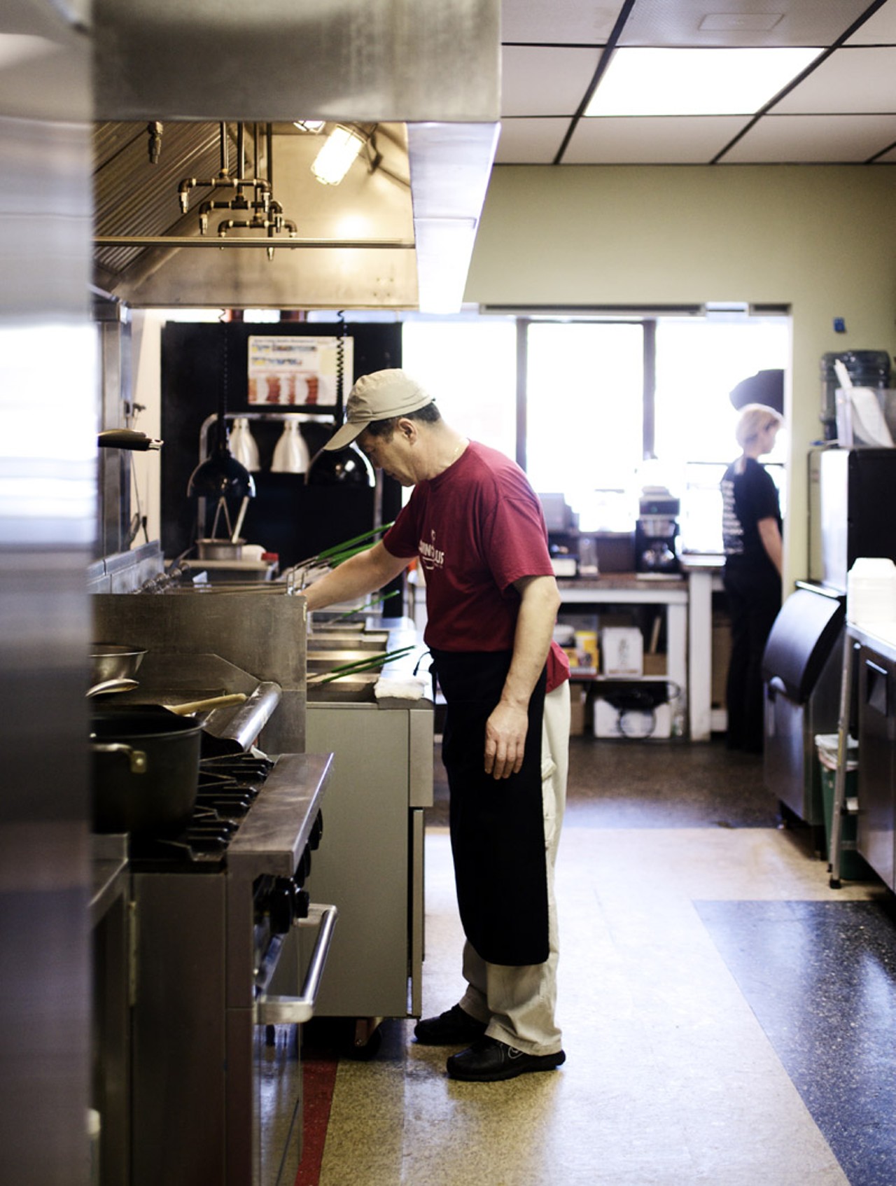 Owner Steve Song at work in the kitchen of O! Wing Plus in Overland, Missouri.