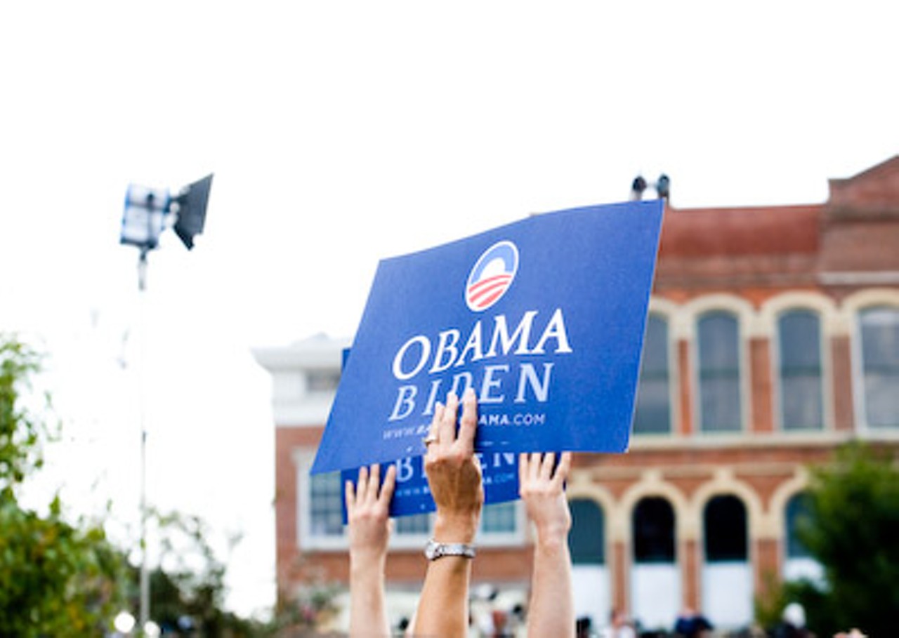 Supporters hold signs for Barack Obama and Joe Biden. The Obama campaign announced early Saturday morning on its Web site that Biden was the VP pick.