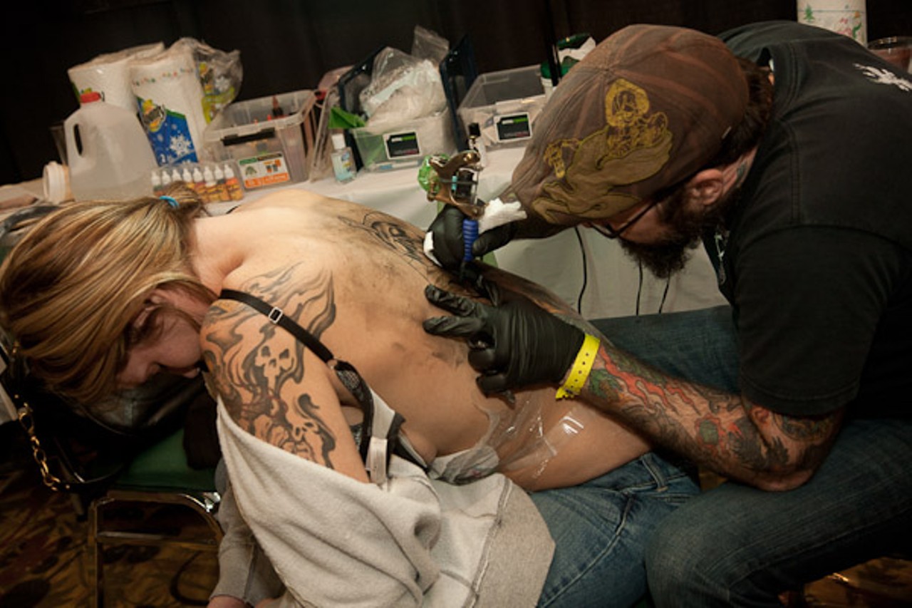 Jeff Cornell from Hidden Hand works on a back piece for Lisa.
