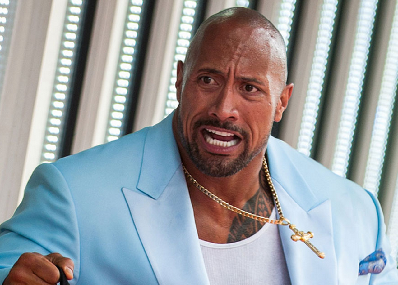 Dwayne "The Rock" Johnson as Paul Doyle, a fictional character written into the film, inspired by...