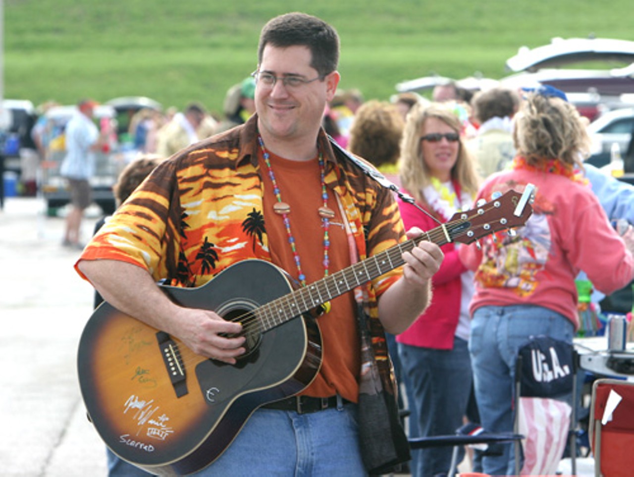 Eric Groos of Camdenton strums to Jimmy Buffett tunes prior to the concert.