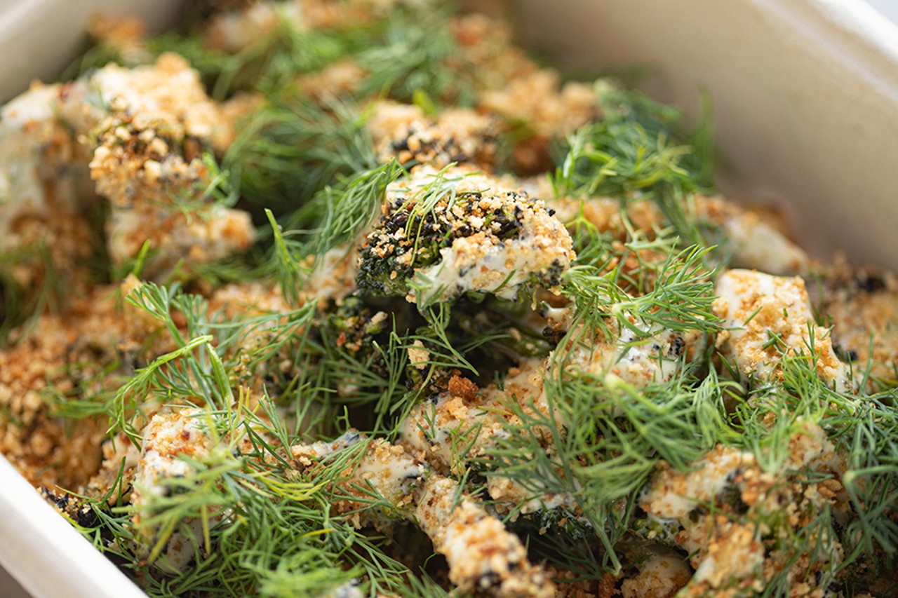 Grilled broccoli caesar salad with fried shallots, breadcrumbs and dill.