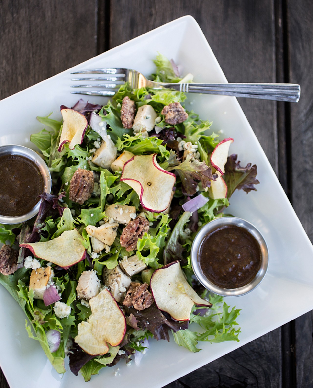 The "Apple Orchard" salad brings garden greens and arcadian lettuce dressed with roasted chicken, red onions, apple chips, gorgonzola cheese, sweet pecans and balsamic vinaigrette.