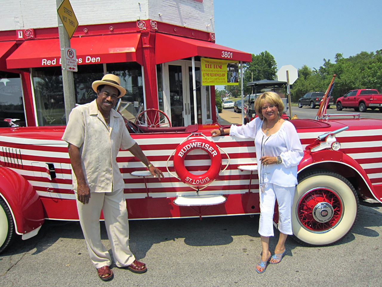 Red Bone and his lady, Diane, in front of the Budweiser Land Cruiser