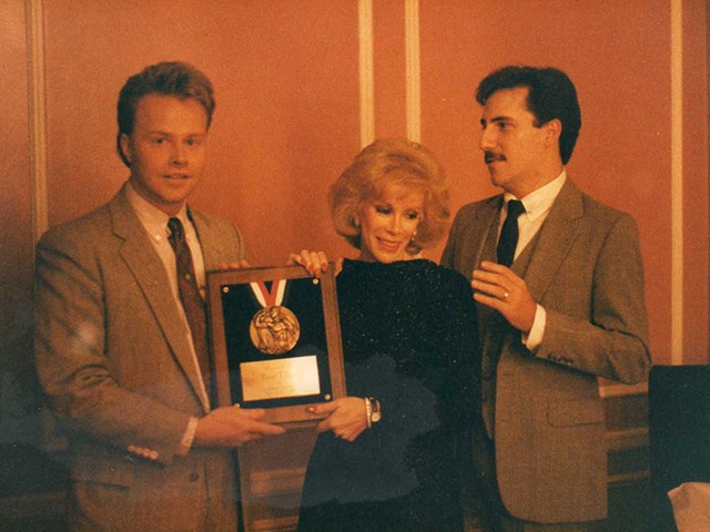 Joan Rivers (center) honors Daniel Flier (left) and John Allen (right) for co-founding Saint Louis Effort for AIDS.