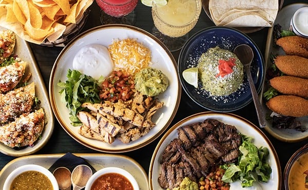 A selection of dishes, including steak and chicken fajitas, from Arzola's Fajitas + Margaritas.