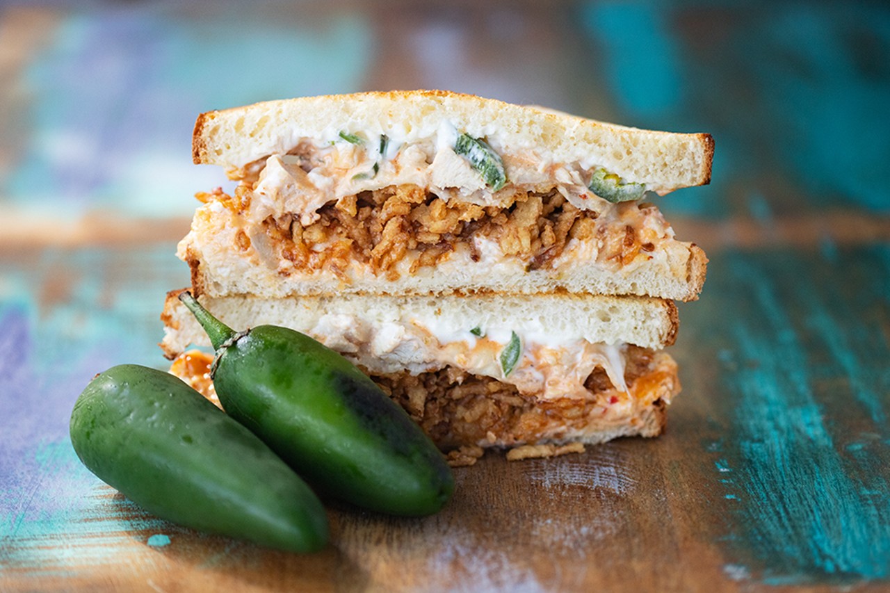 Chicken popper sandwich with shredded chicken, garlic, jalapeno whipped cream cheese, provolone and crispy onions.