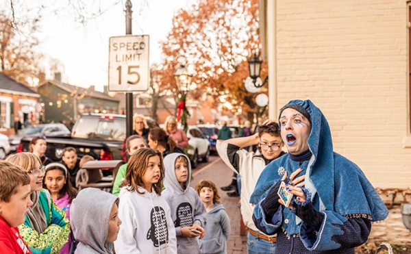 Jack Frost (also known as Ryan Cooper) talks to kids at Christmas Traditions on Historic Main Street in St. Charles