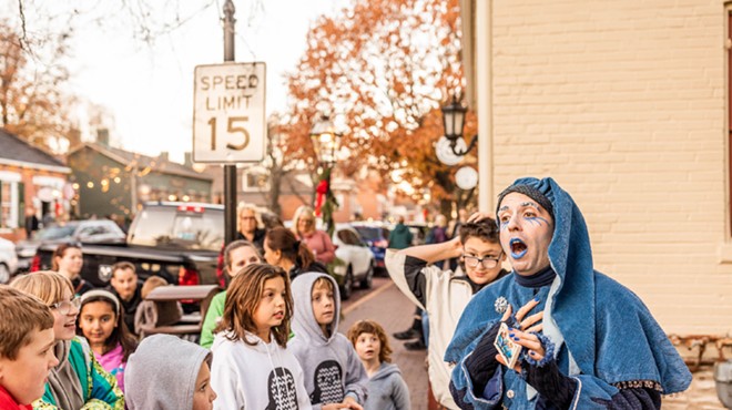 Jack Frost (also known as Ryan Cooper) talks to kids at Christmas Traditions on Historic Main Street in St. Charles