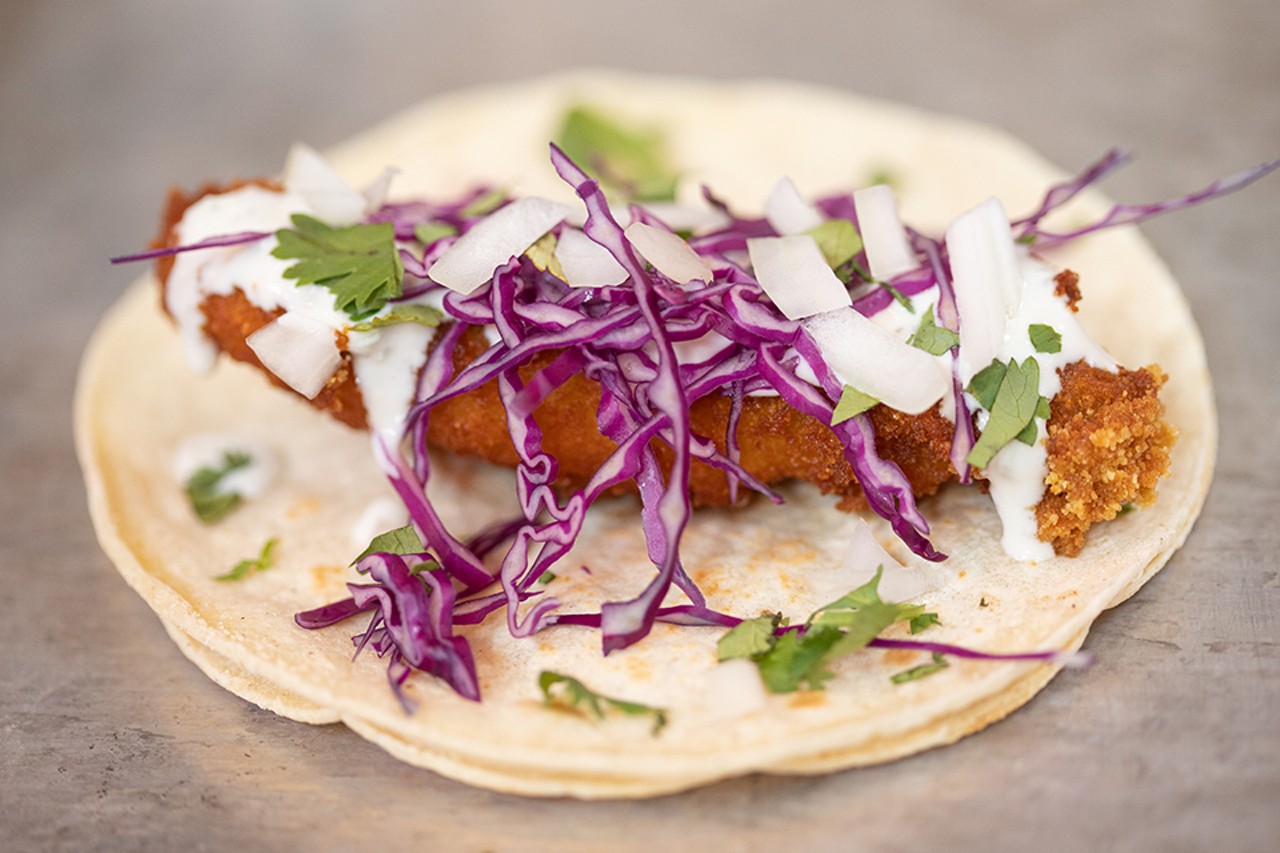 Fish You Were Here taco with deep-fried cod and purple cabbage.