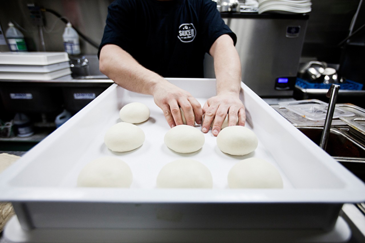 Preparing the calzones' dough.