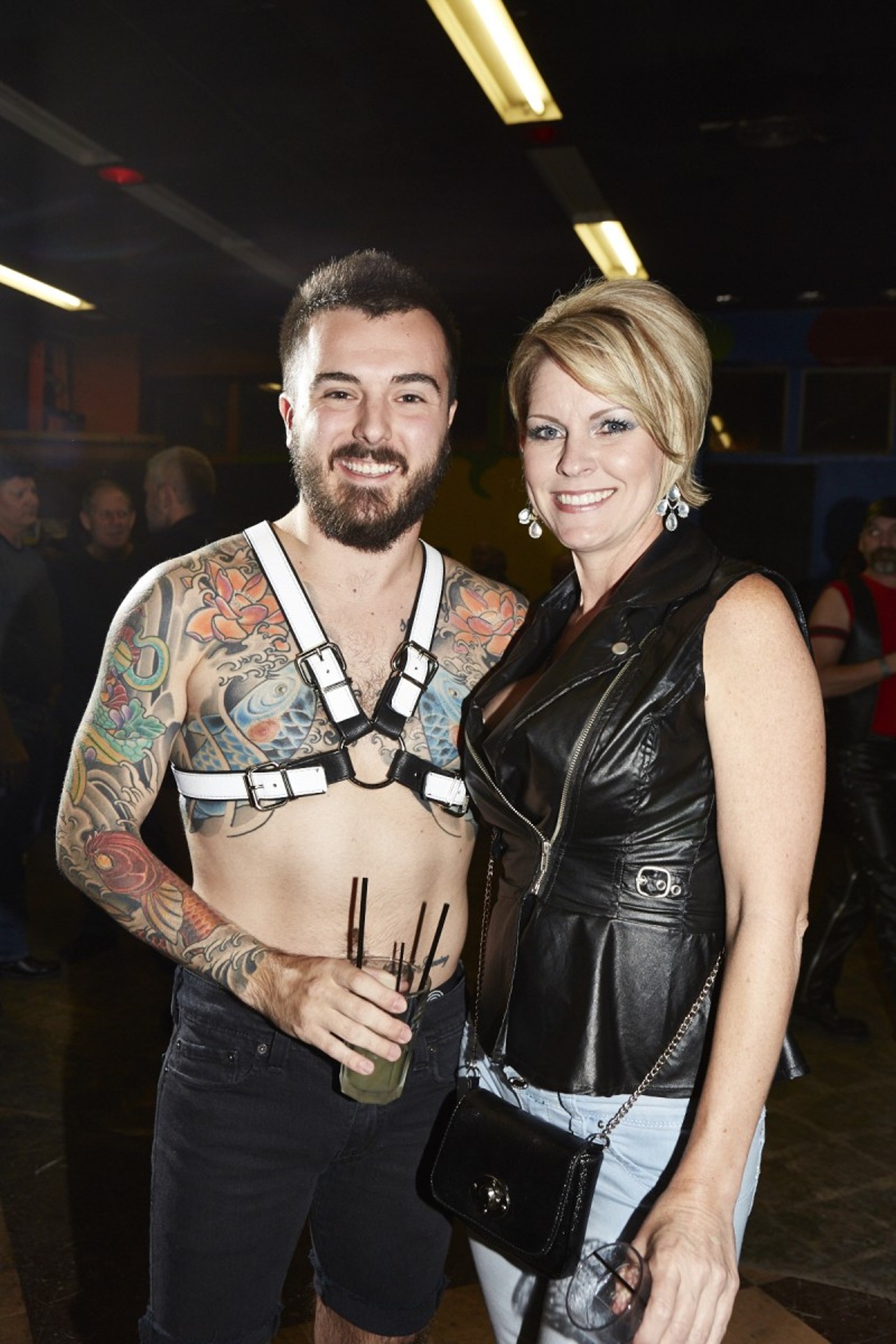 Eddie Schorn and Michelle "Dos" pose for a photo. Eddie is part of the fashion show that showcases leather artist Jerry of Branded Leather.