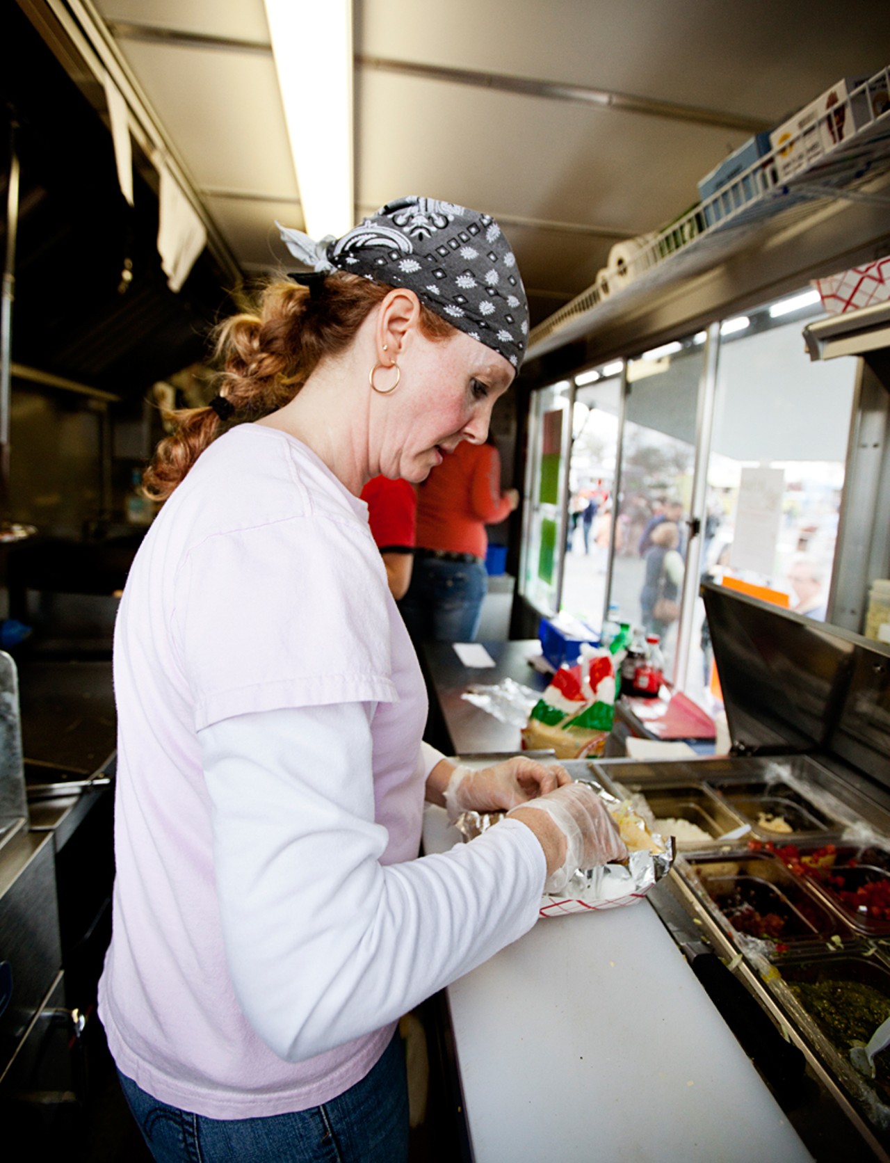 Shelley McMahan, owner of Shell's Coastal Cuisine, at work in the food truck.