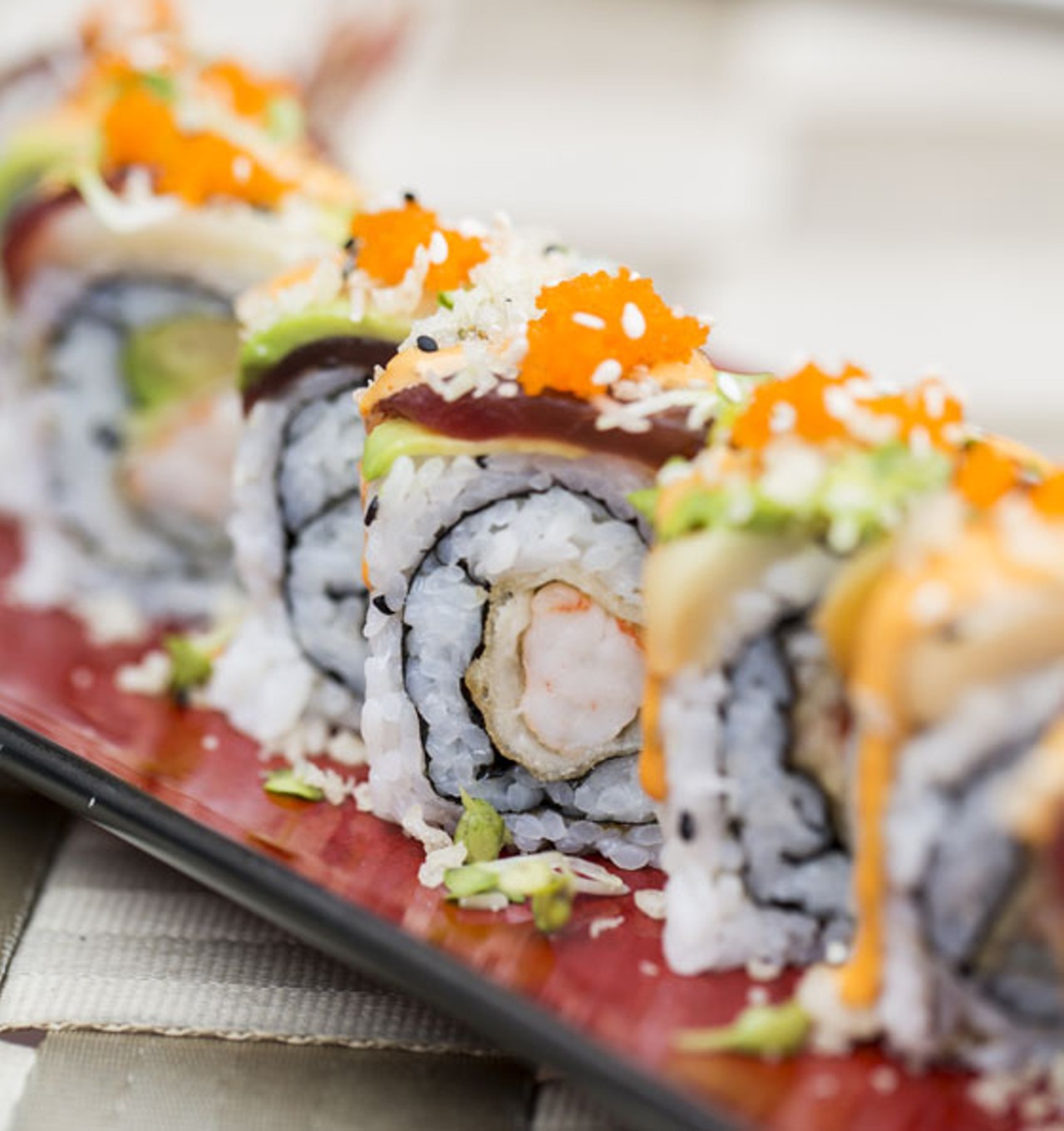 The "Sea Dragon" roll brings fried shrimp tempura, avocado and Japanese mayo. It's all topped with red tuna, white tuna, radish sprouts, masago crumbs, eel sauce and spicy mayo.