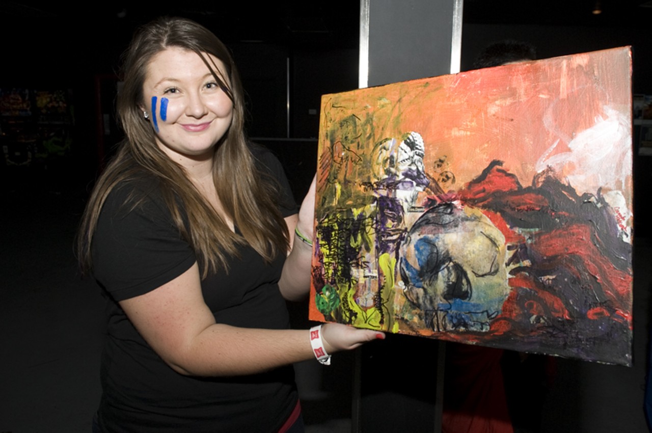An art student with her painting that she later gave to Alexis Krauss of Sleigh Bells.