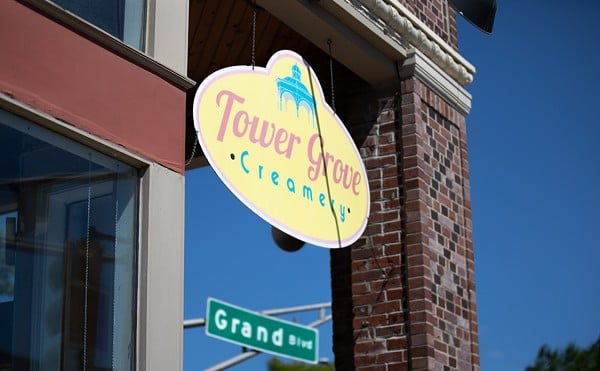 Tower Grover Creamery sign with Grand Boulevard sign behind.