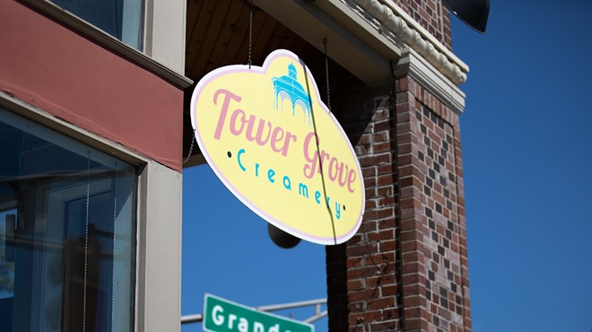 Tower Grover Creamery sign with Grand Boulevard sign behind.