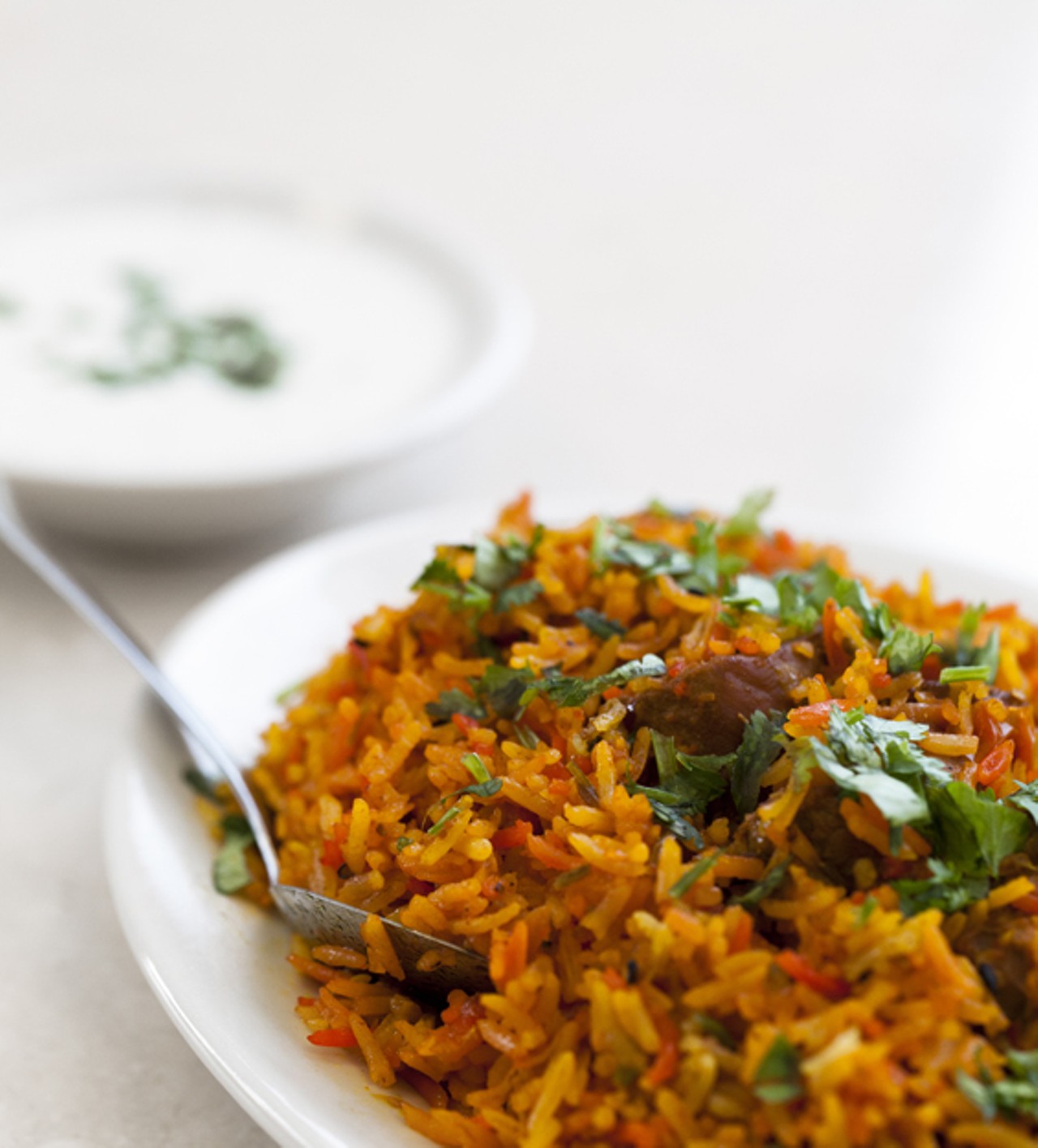 Chicken Biryani is basmati rice cooked with chicken and spices. (The Biryani is also available with chick peas, goat or lamb).