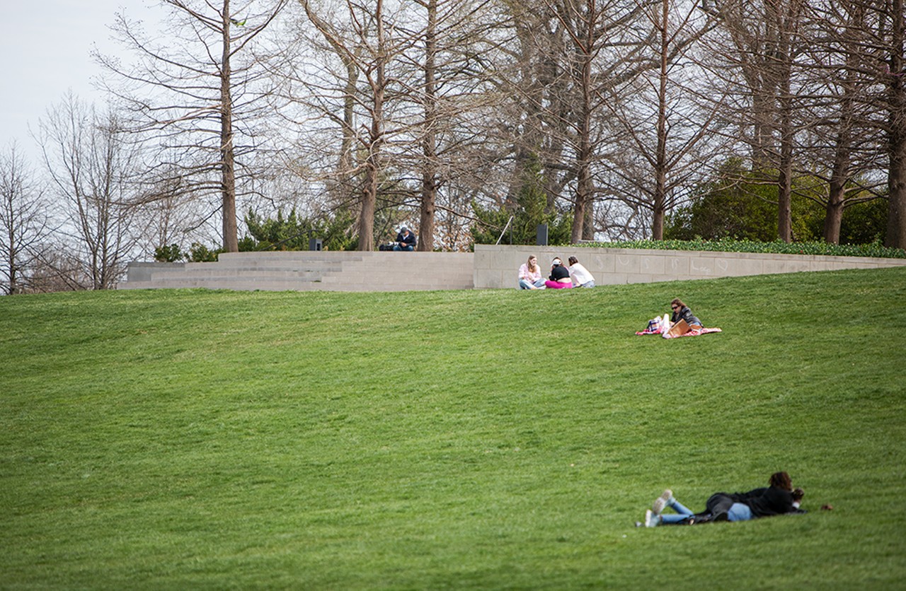 Groups of people lay out at Art Hill.