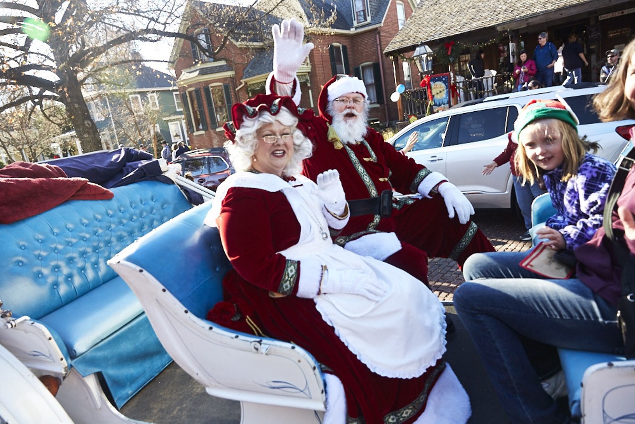 Santa and Mrs. Claus enjoy a sleigh ride.