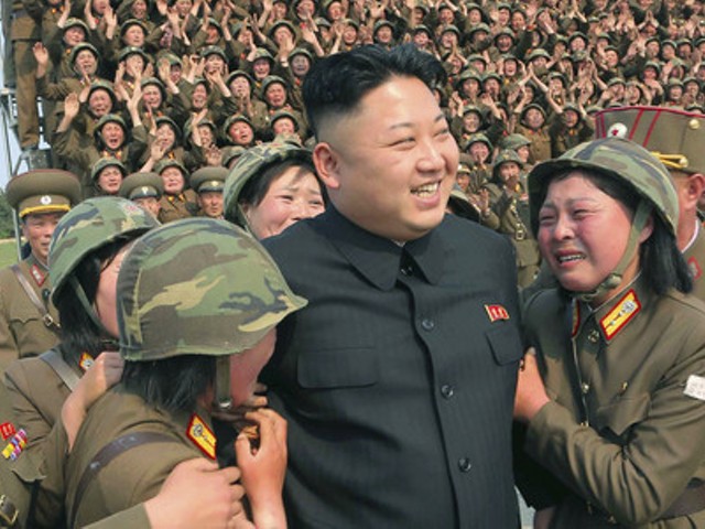 Kim Jong Un (center) may have benefited from the IT contractors your company hired, the FBI says.