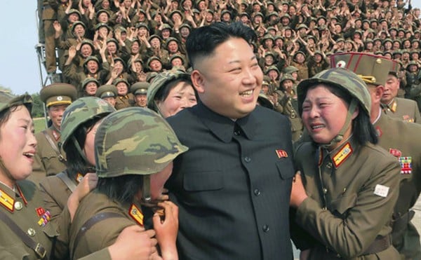 Kim Jong Un (center) may have benefited from the IT contractors your company hired, the FBI says.
