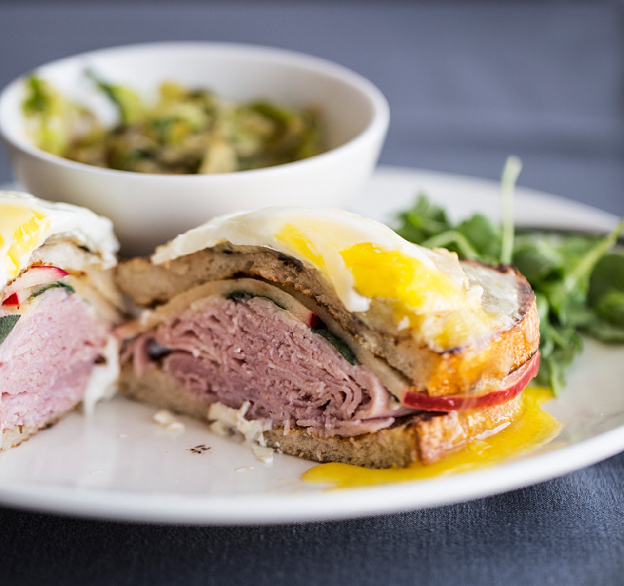 Panorama croque-madame, made with ham, apple, sage, gruyere, bechamel and egg.