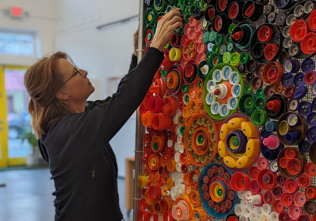 Artist Adrienne Outlaw created Consumed, an exhibit showcasing her family's garbage to address plastic pollution.