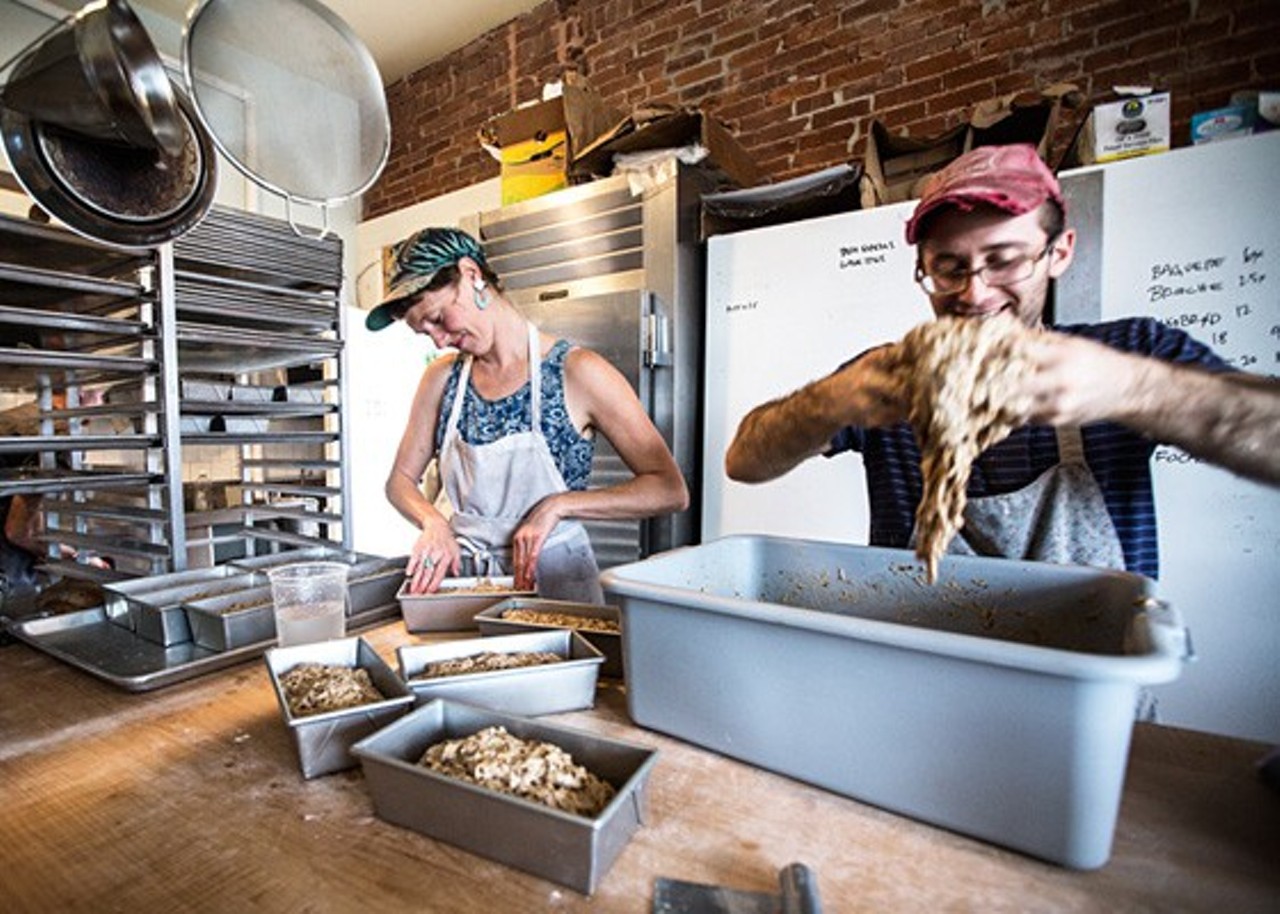 Jenny Wilson and Jake Marks of Red Fox Baking preparing Rugbr&oslash;d (a Danish bread) in the Grove East Provisions kitchen. Photo by Jennifer Silverberg.